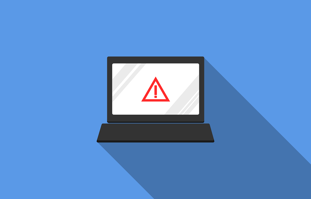 Computer screen with a red warning triangle in the middle